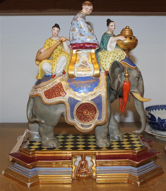 Meissen-style polychrome porcelain group of Chinese figures riding an elephant, on shaped plinth base (faults)